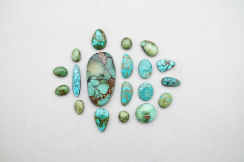 a collection of turquiose cabochons