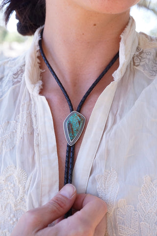 image of a person wearing a turquoise and silver bolo tie