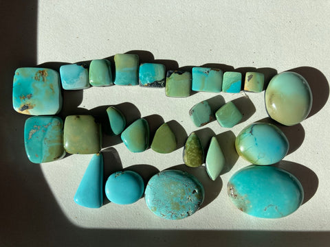 an array of turquoise cabochons