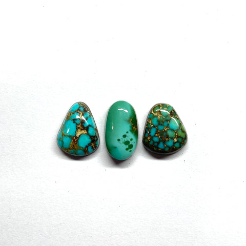 three turquoise cabochons