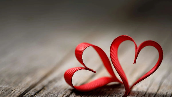 Heart-Shaped Ribbons on a Wooden Floor