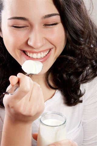 woman eating yogurt