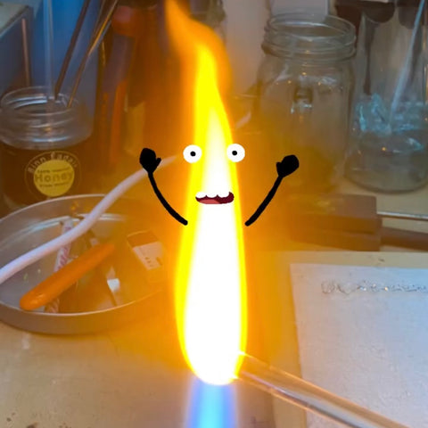 A flame with cartoon arms, eyes and mouth