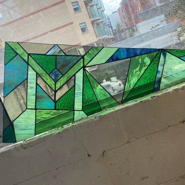 Green geometric wedged shaped stained glass