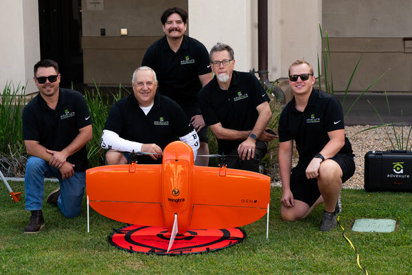 The Advexure team pictured with a WingtraOne Gen II at a drone industry event