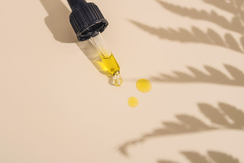 cbd tincture on plain background