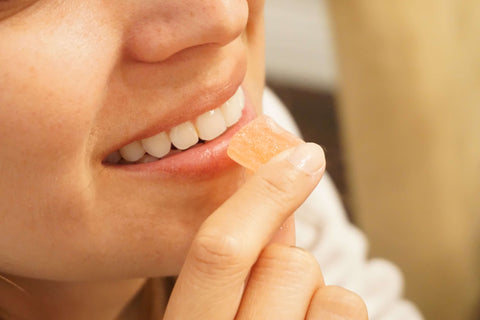 person eating cbd gummy