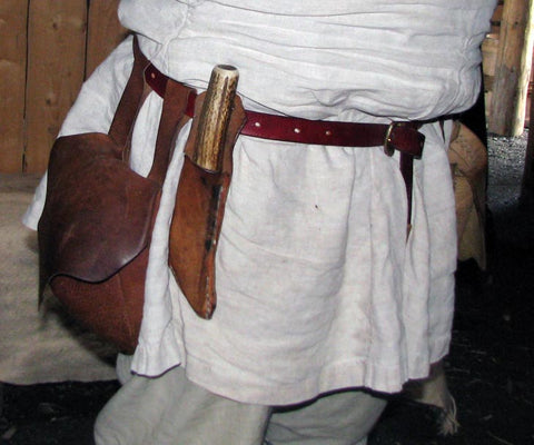 viking belt reenactment in leather with bronze buckle and knife and bag attached