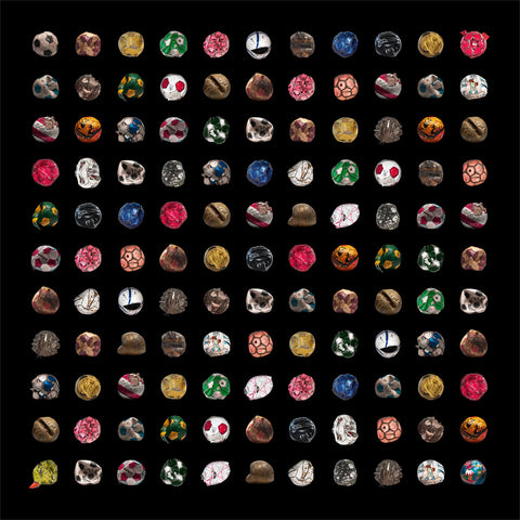 Footballs arranged into a collage on a black background