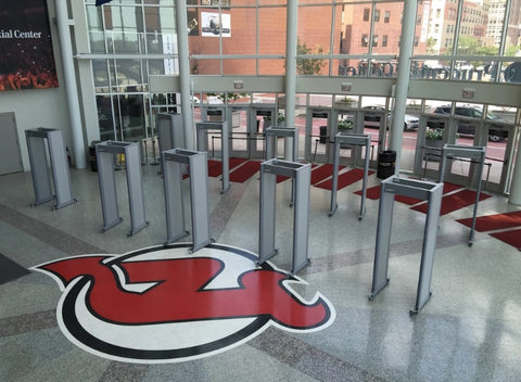 An arena and stadium security system at an event with walkthrough security metal detectors