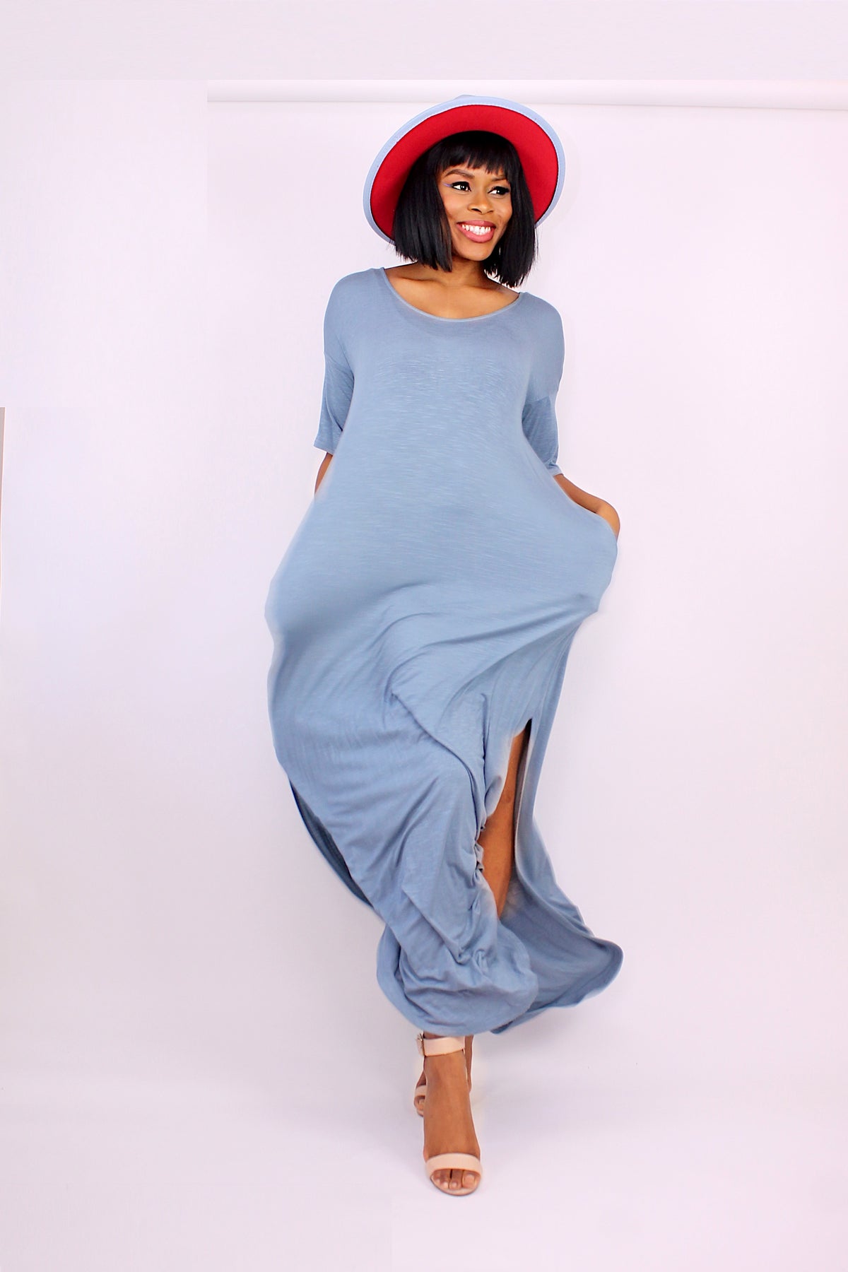 MODEL IN BLUE STEEL MAXI DRESS