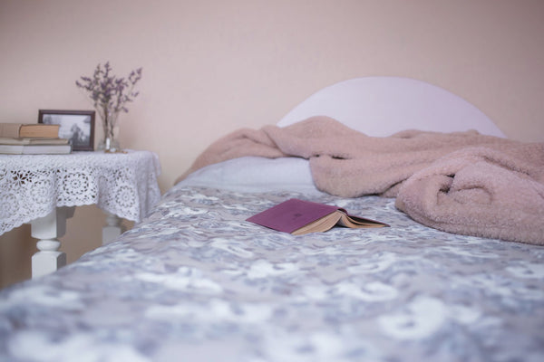 bed with book and nightstand