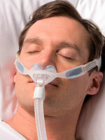 man sleeping with CPAP mask