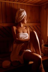 Woman Relaxing in Sauna