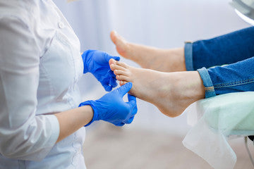 Woman Getting Nail Treatment