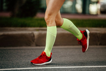 Woman Running in Compression Socks