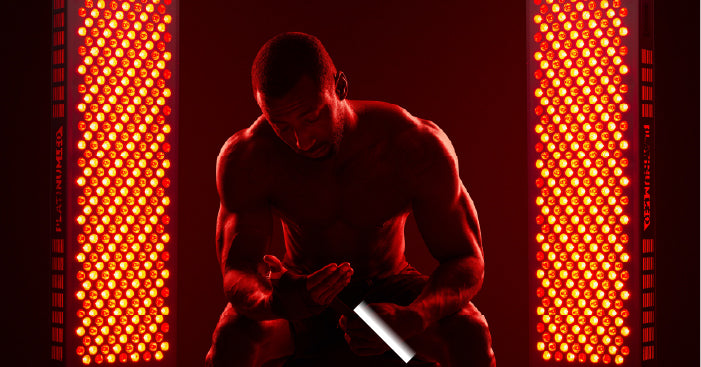 man using red light therapy