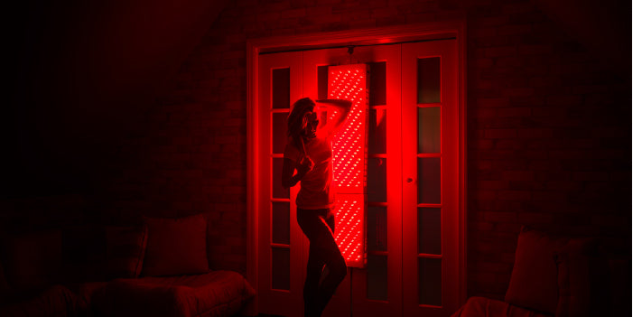 Woman using red light therapy