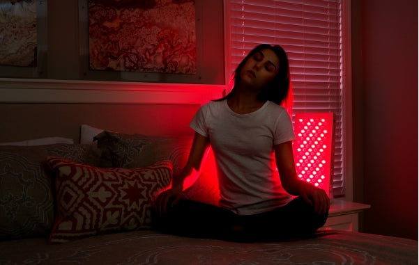 Person using red light therapy