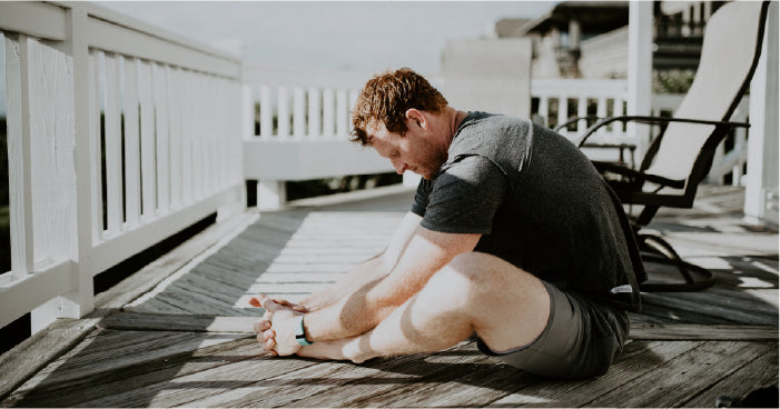 Man Stretching At Home