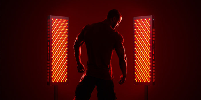 muscular man using red light therapy