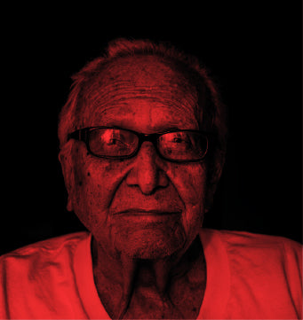 Old Man with red light on his face