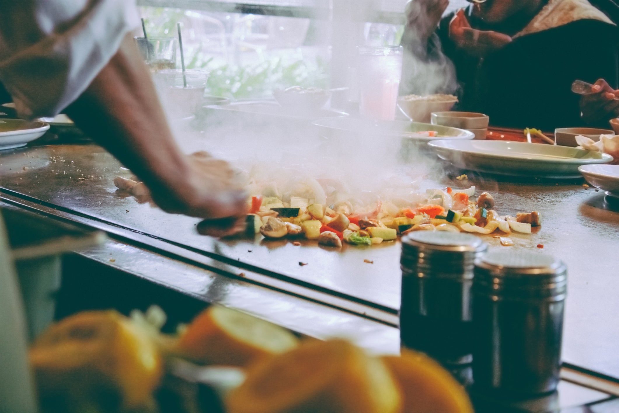 Asian style cooking on a flat grill