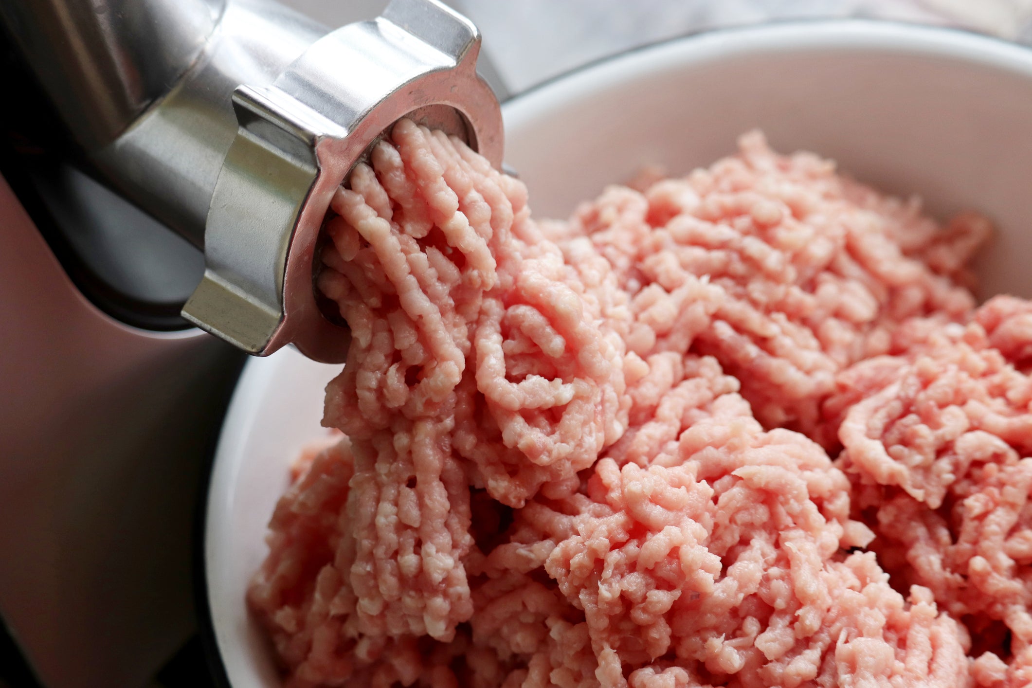 Meat being minced
