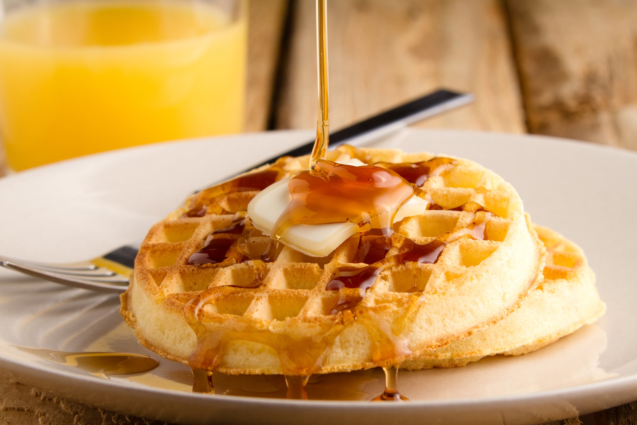 Belgian waffle topped with butter and syrup