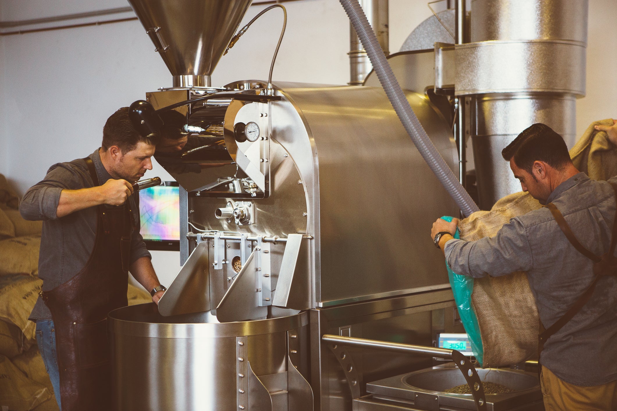 A team of roasters monitoring the roast