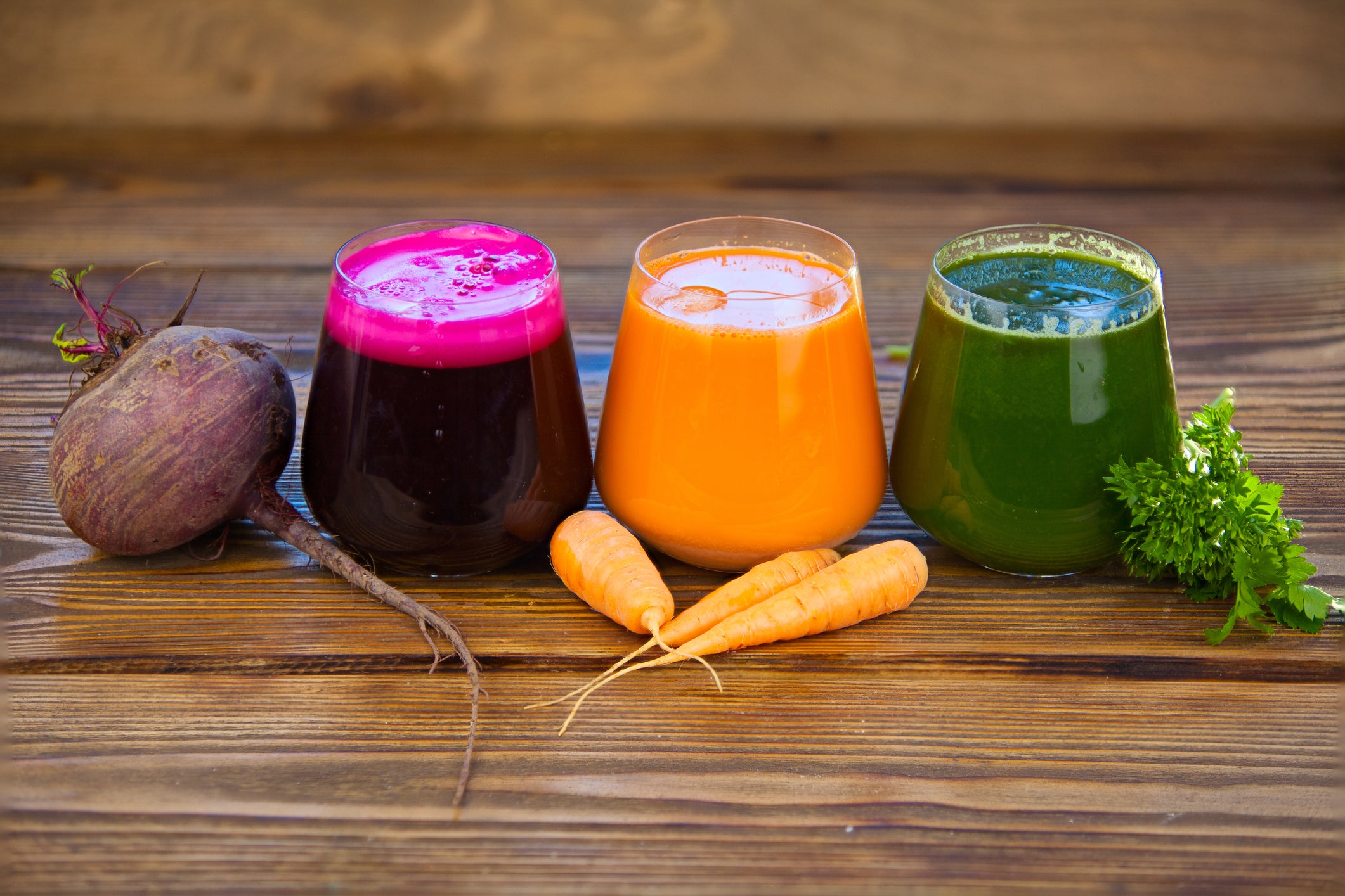 Kale juice, carrot juice, and beetroot juice