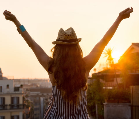 Brunette woman with amazing hair wearing a fedora 