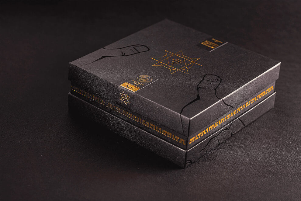 To'ak 50g Art Series Edition - a black and gold box rests on a hard black surface