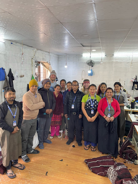 Mexicali Blues family visiting a fair trade factory in Nepal along with their workers