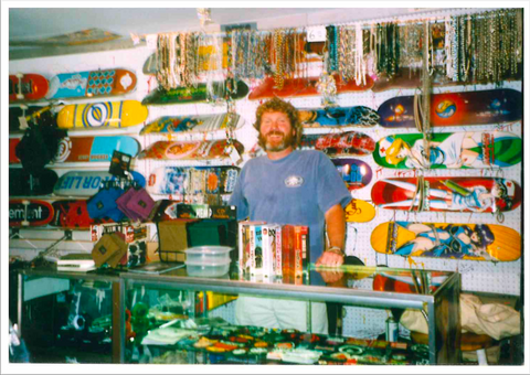 Pete Erskine with assortment of skate boards at original Mexicali Blues "Street and Skate Shop"