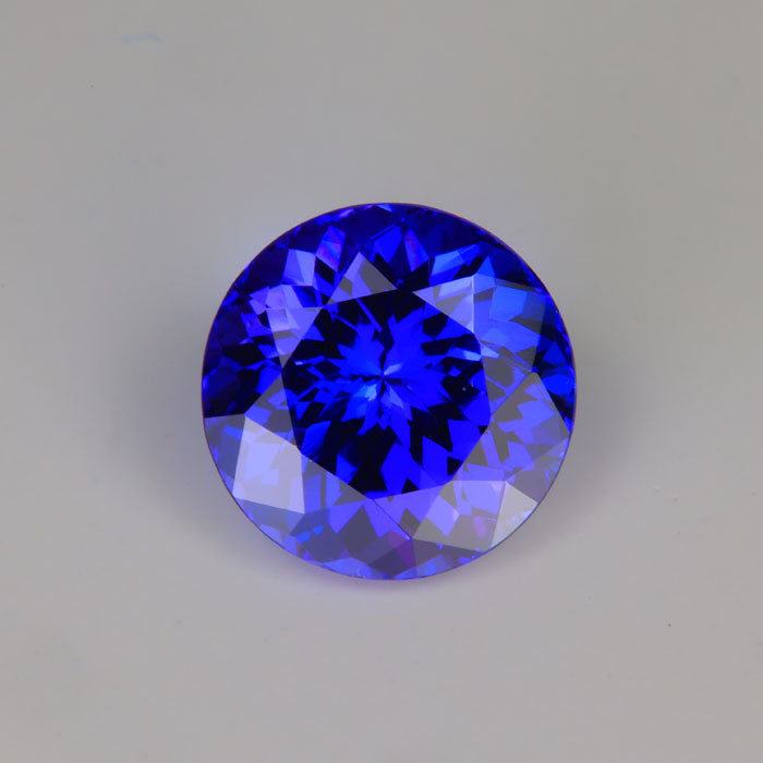 Round Brilliant Cut Tanzanites 5.35 Carats and 6.86 carat and one pair of 14 kt earrings - Tanzanite Jewelry Designs product image