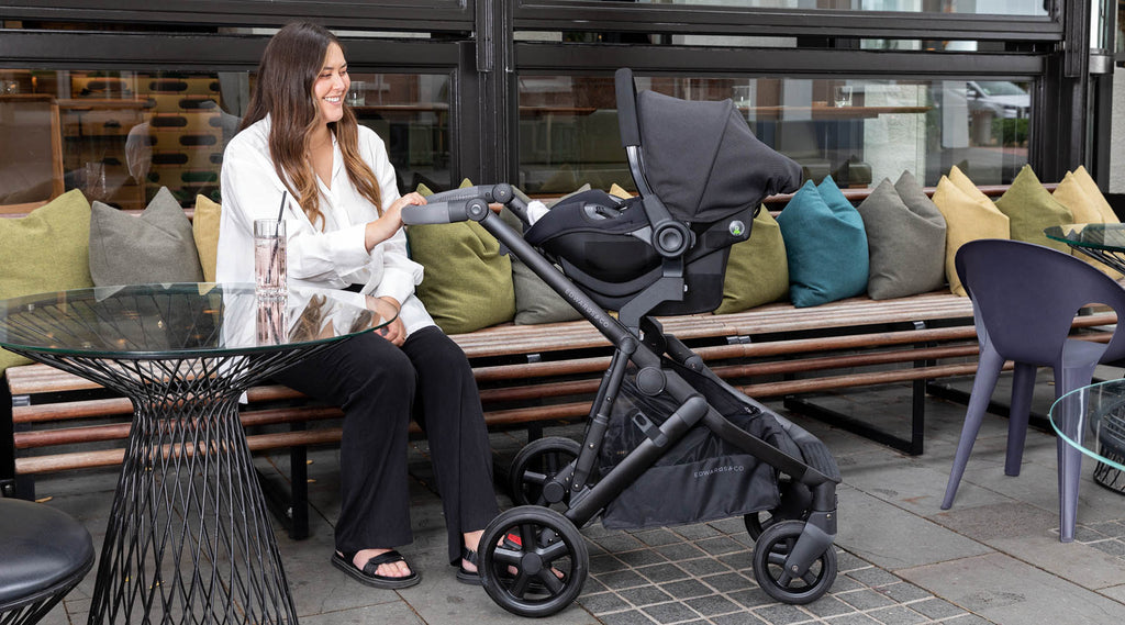 Olive pram with Avery Capsule attached