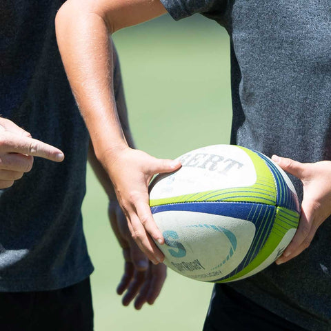 Hands Fat On The Ball Receiving A Rugby Pass