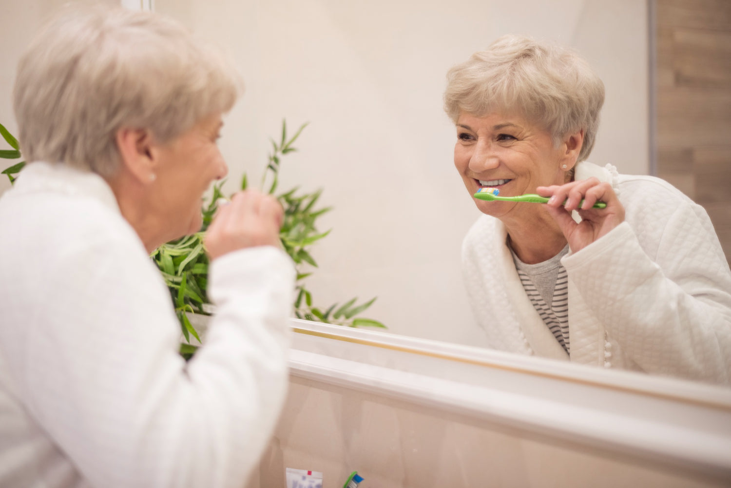 Senior brushing her teeth