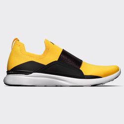 black and yellow sneakers women's