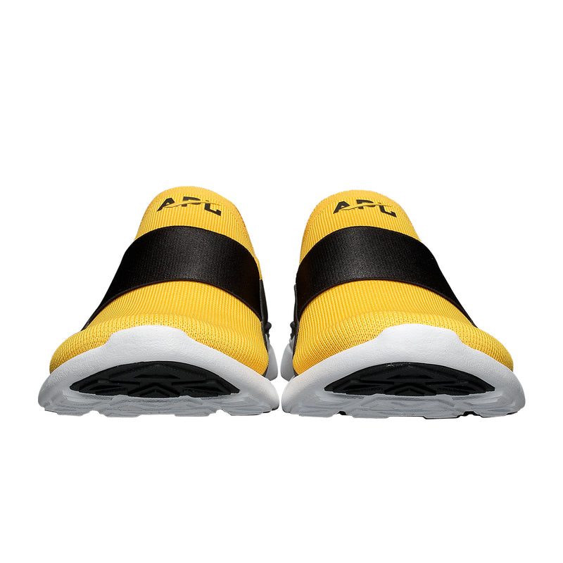 black and yellow tennis shoes