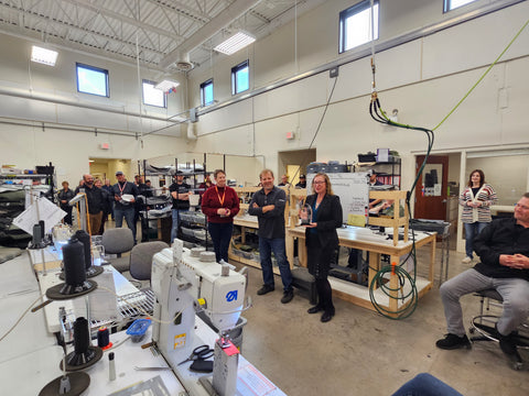 Picture of SCS Interiors Owner on the Production Floor with Cirrus Representatives