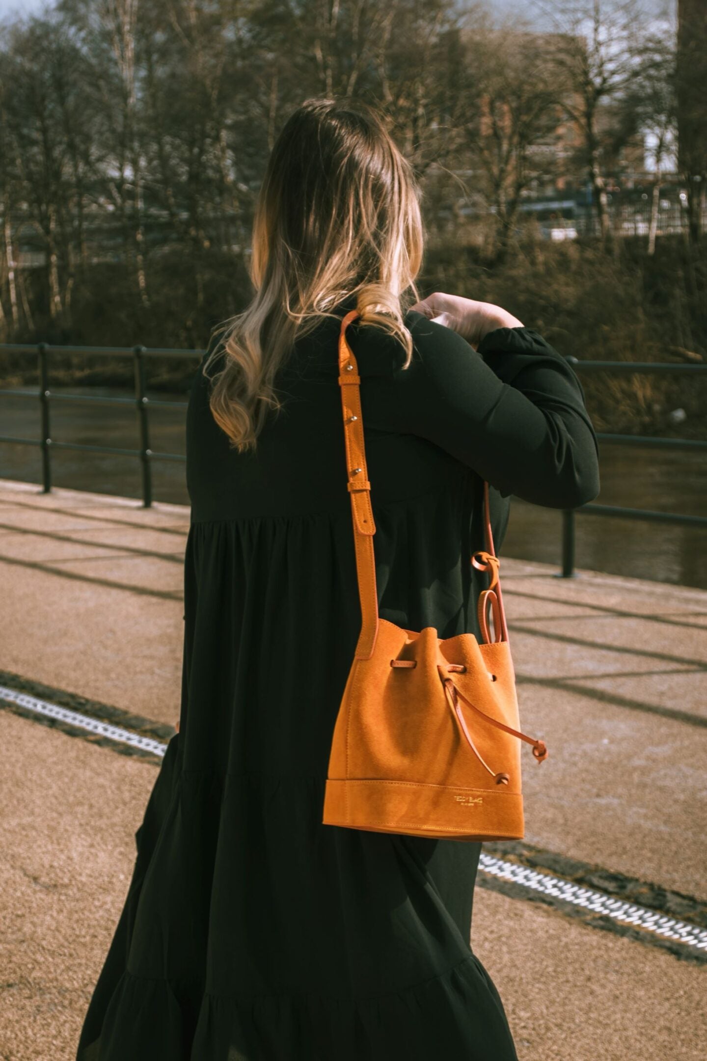 A Teddy Blake handbag and a dress over jeans - The Grey Brunette