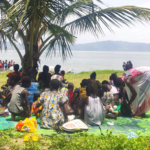People sat at Lake Bosomtwi