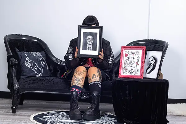 Brisbane Tattooist Death By Piss with her A4 Art Prints at Tragic Beautiful