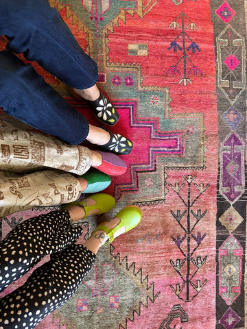 Overhead shot of a gorgeous Persian Rug and Charlotte Stone Shoes
