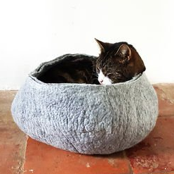 cat asleep in basket, christmas gift ideas for cats