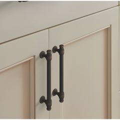 oil rubbed bronze cabinet pulls on a white cabinet