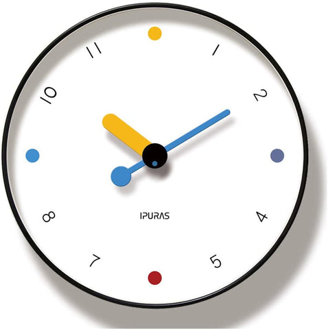 Contemporary looking white clock, with red, blue and yellow accents, the only numbers not shown are 12, 3, 6 and 9, they are shown with colored dots