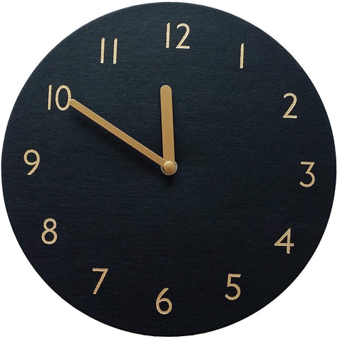 Black leather clock, no frame, numbers are block like and gold, hands are gold.